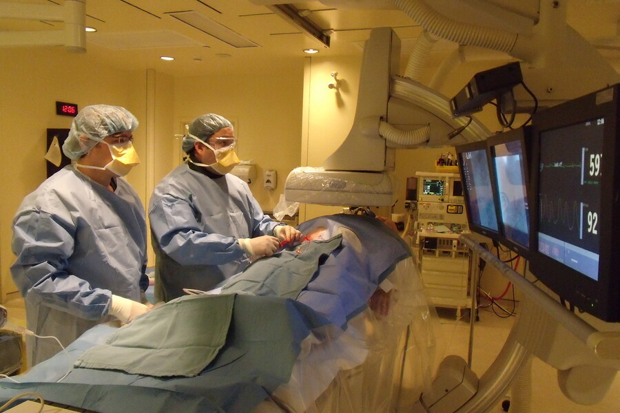 Radiologists performing a procedure