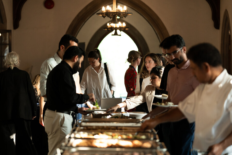 attendees at the catered buffet table